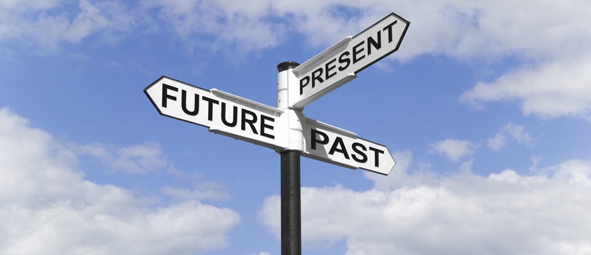 Concept image of a Future Past & Present signpost against a blue cloudy sky